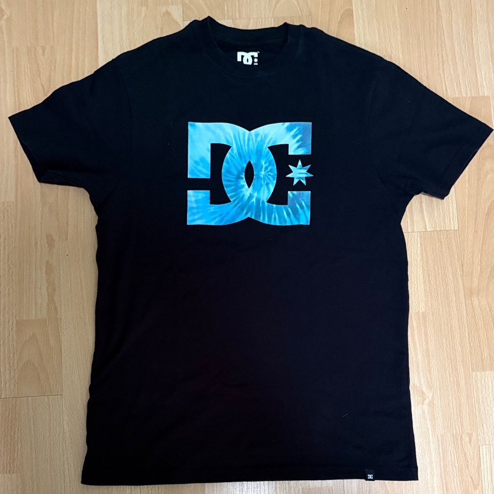 DC Black Tee with Vibrant Blue Emblem